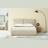 Wide-angle lifestyle view highlighting the bed's presence in a bright suite with high-ceilinged architectural details