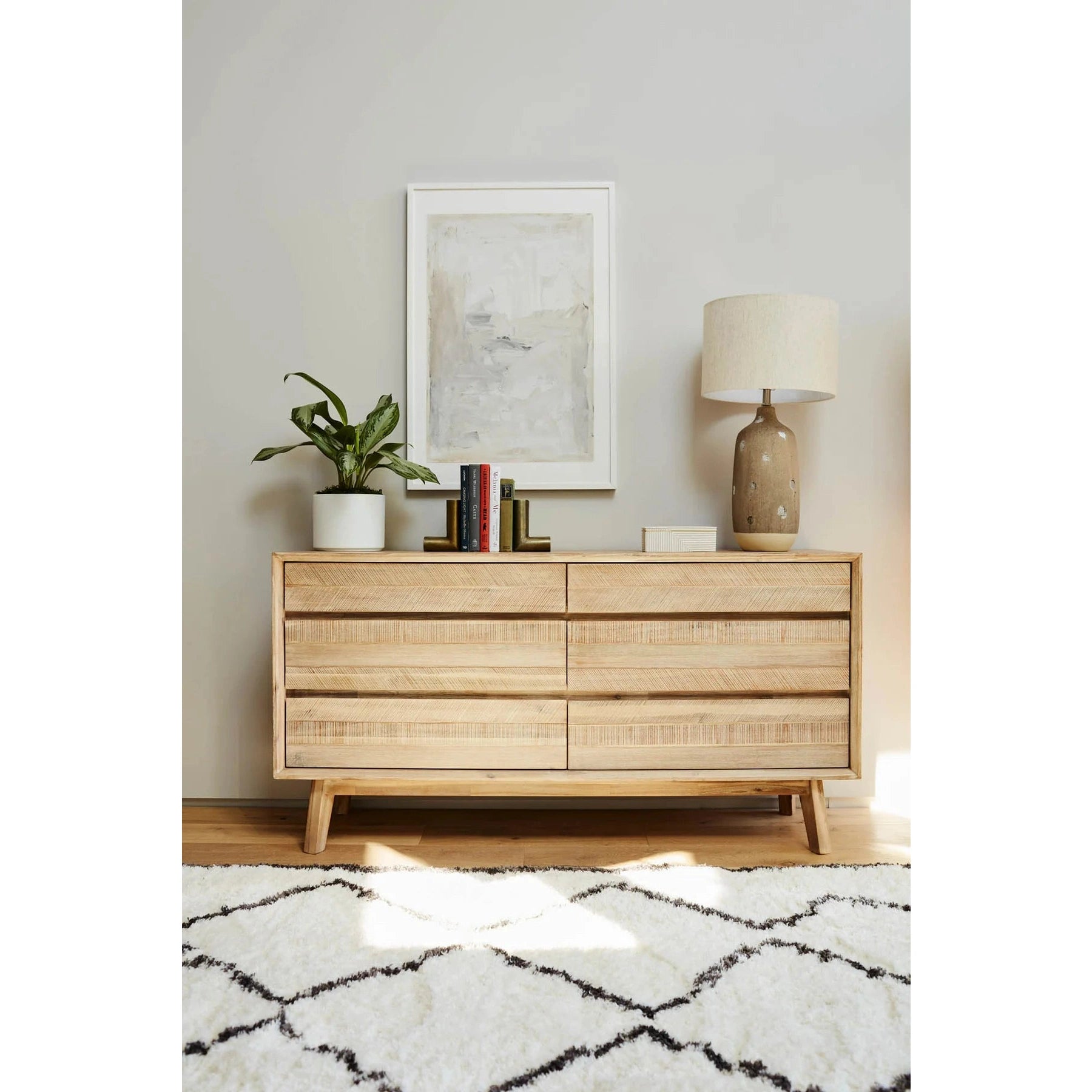 Front view of the Gia 6-drawer dresser featuring a light natural wood finish with a horizontal planked design and minimalist handle-free drawers