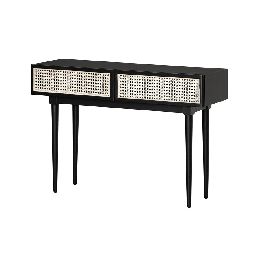 Three-quarter perspective view highlighting the clean minimalist lines and the organic texture of the cane drawer fronts