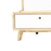 Close-up lifestyle view of the white bouclé headboard styled with neutral pillows and a minimalist side table