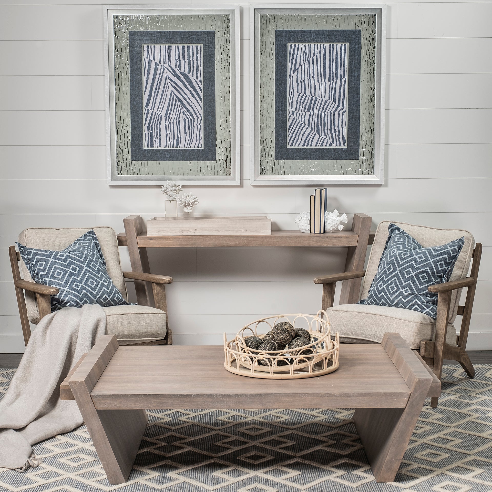 Lifestyle shot featuring the Elaine III console table styled in a bright contemporary living room with neutral armchairs and decor
