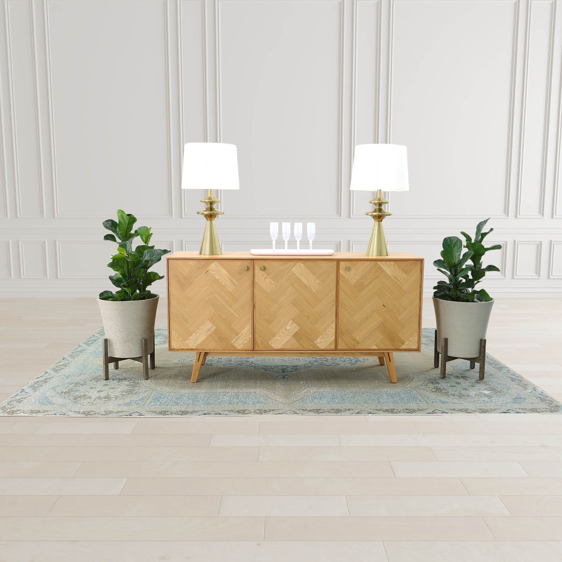 Straight-on front view of the Colton sideboard featuring a light natural oak finish and intricate herringbone parquet patterns across three cabinet doors