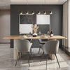 Wide-angle lifestyle view of the table set for dining with grey chairs and minimalist pendant lighting