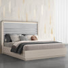Three-quarter perspective view highlighting the sleek light wood base and the architectural horizontal stitching of the lighted headboard