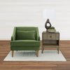 Lifestyle perspective featuring the West nightstand paired with a green upholstered accent chair and sculptural floor lamp