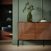 Lifestyle shot featuring the sideboard in a bright office setting highlighting its versatility as a storage credenza