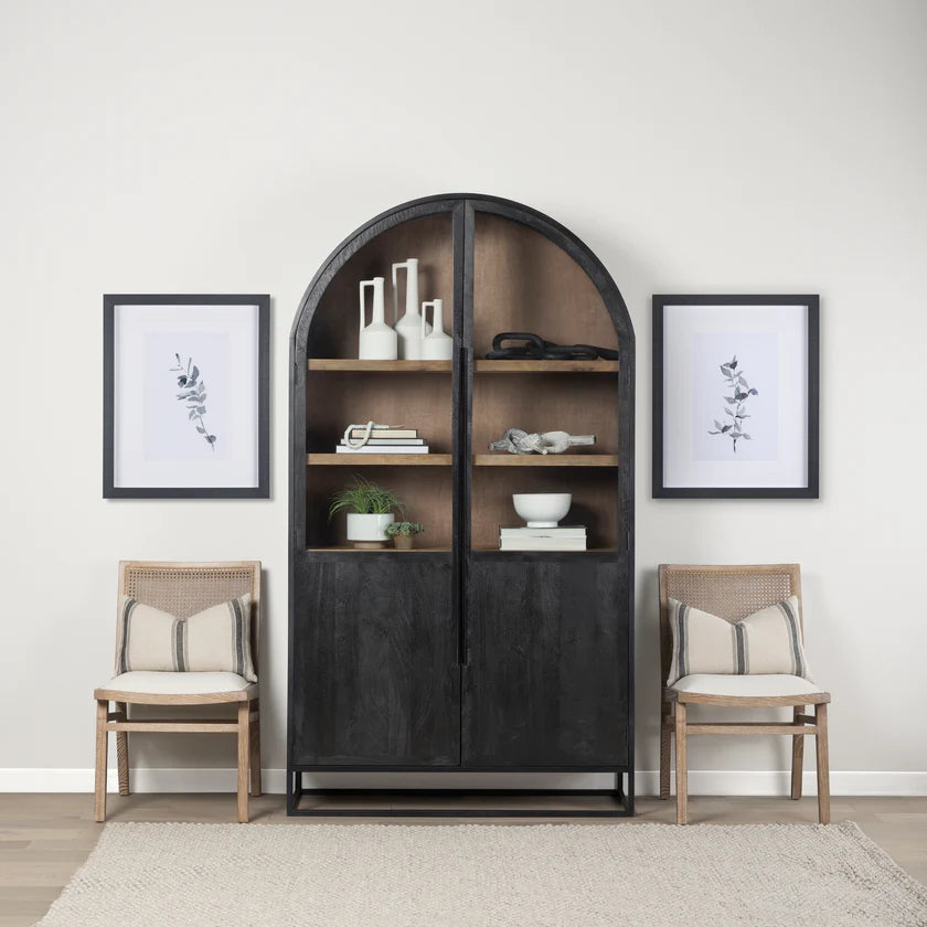 Straight-on front view of the Sloan arch cabinet featuring a matte black finish and natural wood interior shelves