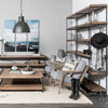 Lifestyle shot featuring the Trey IV shelving unit styled in a modern industrial living space with contemporary armchairs and decor