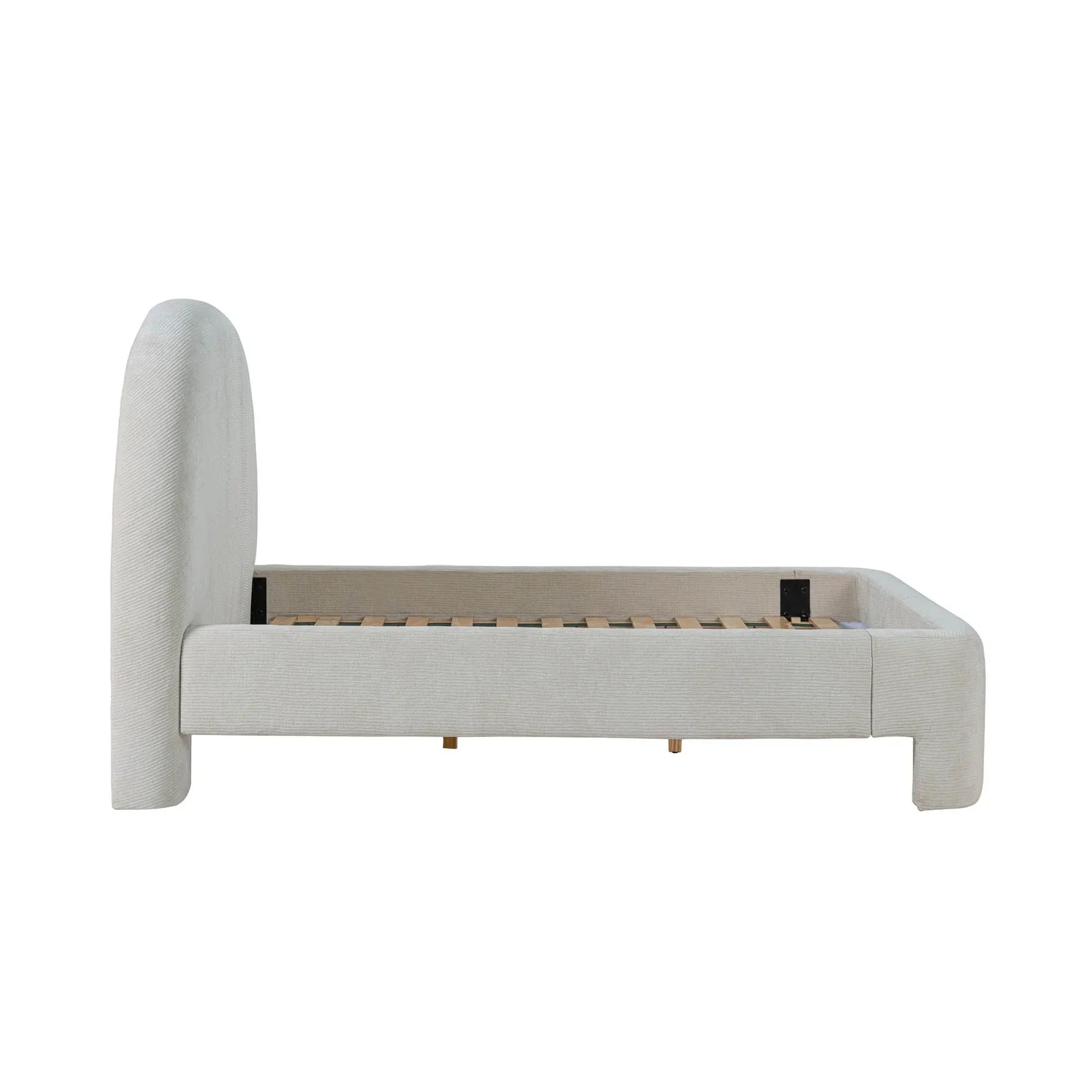 Side profile view showcasing the seamless upholstery and the substantial architectural depth of the arched headboard