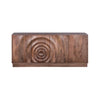 Straight-on front view highlighting the architectural circular carving and the seamless integration of the cabinet doors into a continuous design