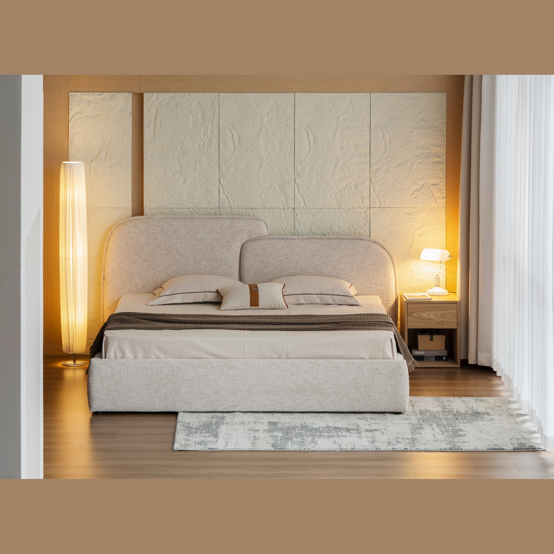 Front view of the Rusty storage bed featuring a textured cream fabric and a unique asymmetrical curved headboard