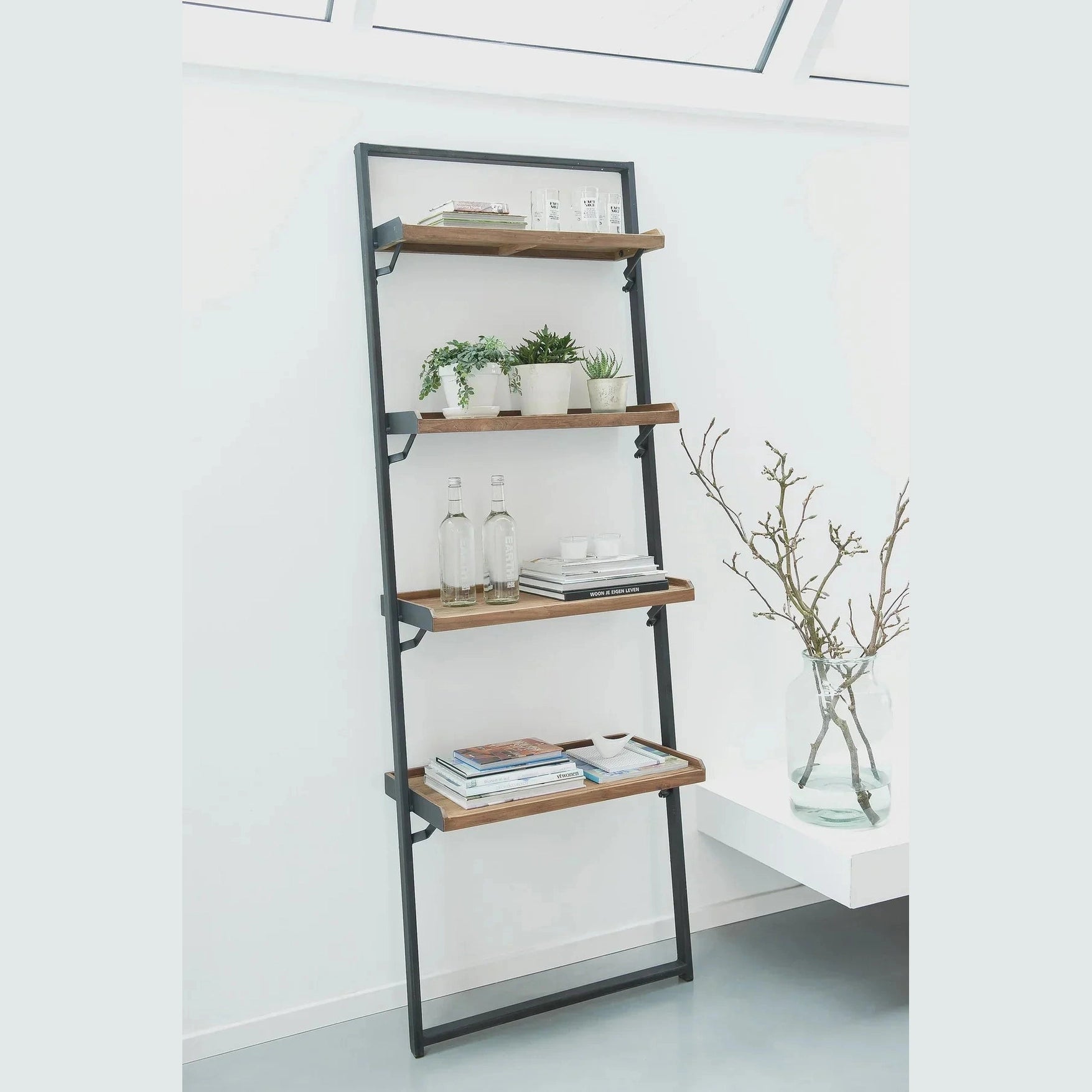 Straight-on front view of the D-Bodhi wall rack featuring a slim black metal frame and four reclaimed wood tray shelves