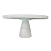 Side profile shot highlighting the clean geometric silhouette and balanced proportions of the round concrete table