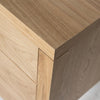 High-angle perspective focusing on the seamless top corner construction and the durable textured oak grain