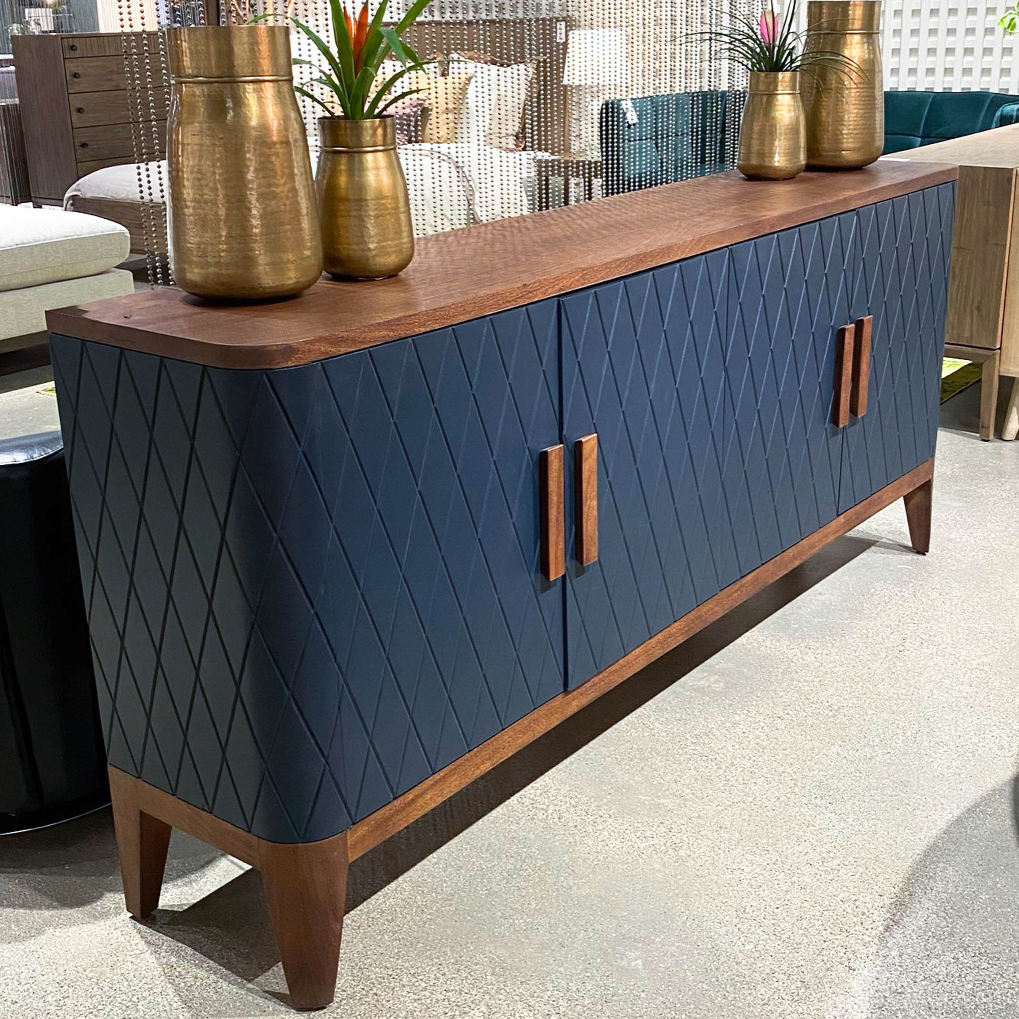 Straight-on front view highlighting the symmetrical diamond texture and the slim, vertical natural wood door pulls