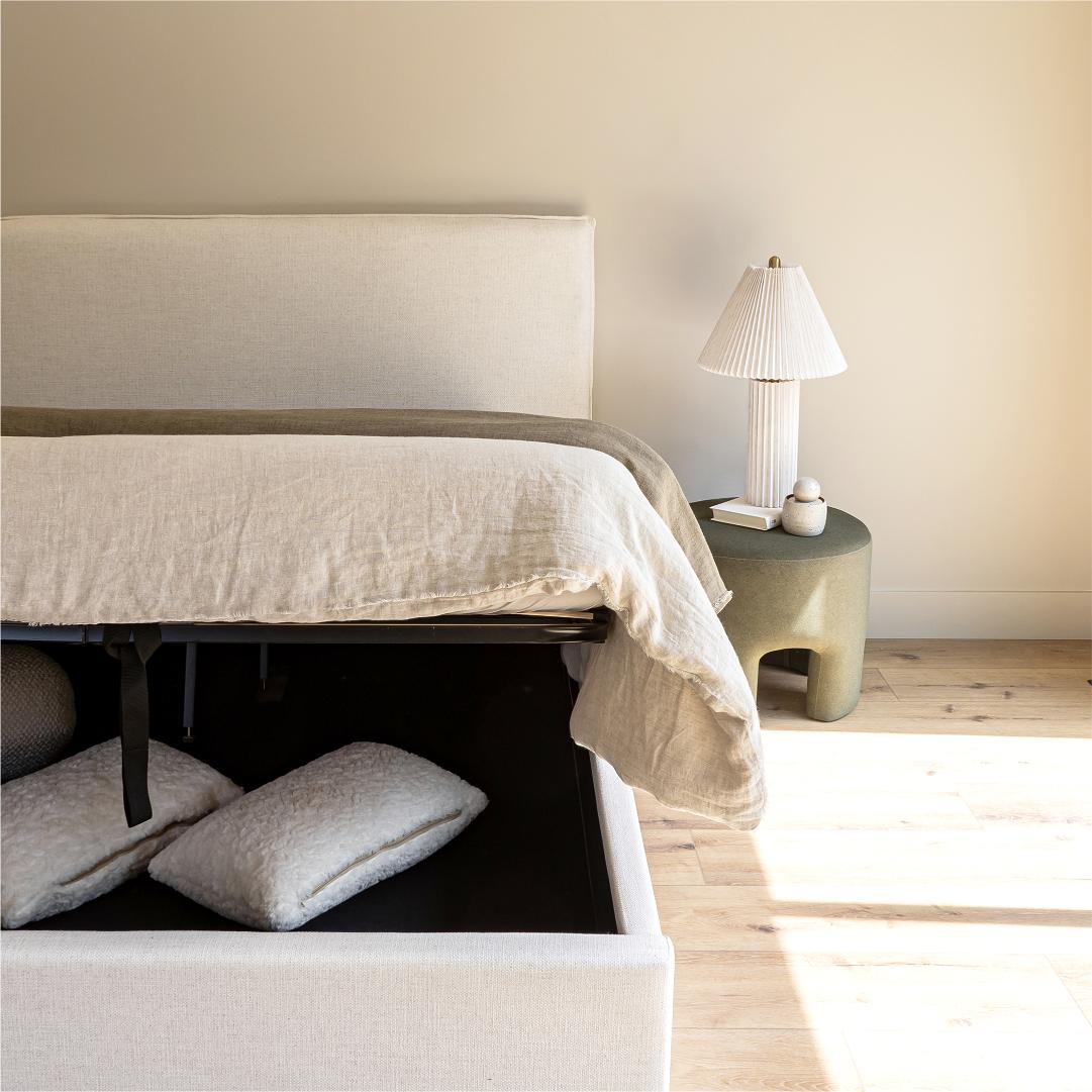Front view highlighting the soft textured upholstery and the clean architectural lines of the bed frame