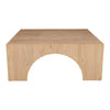 Straight-on front view showcasing the symmetrical arch design and solid wood block construction of the square coffee table