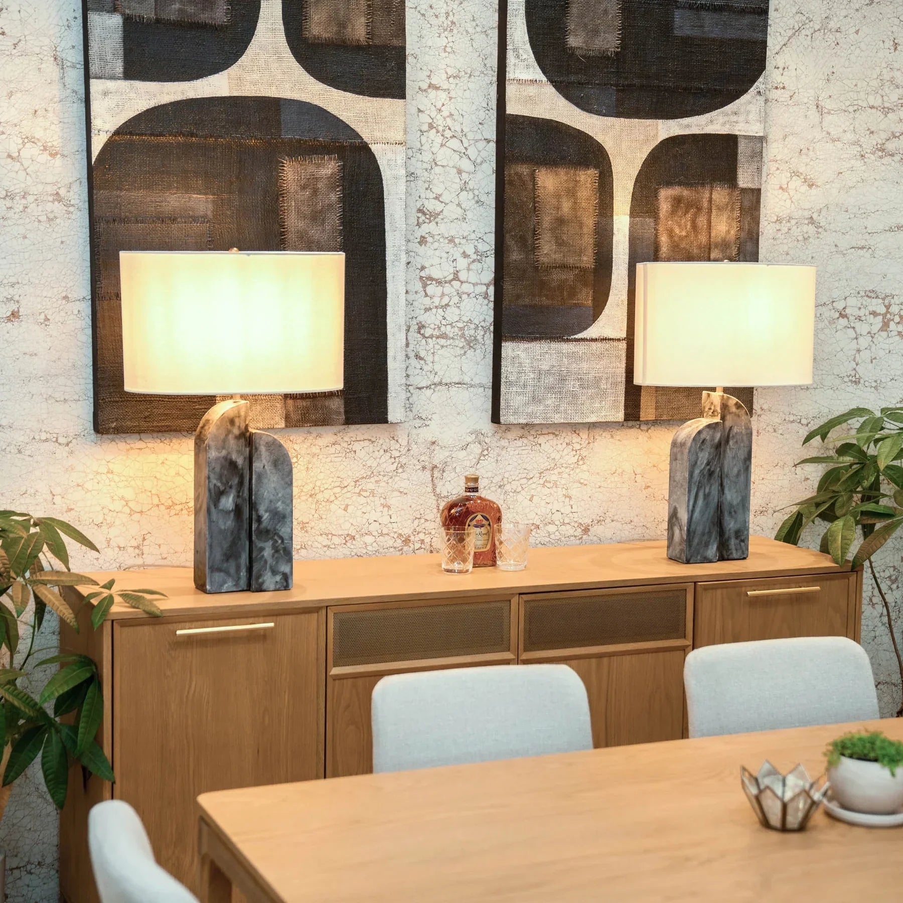 Three-quarter perspective view of the Arizona 4-door sideboard in a natural oak finish featuring two central metal mesh door inlays and tapered wood legs