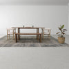 Alternative wide-angle lifestyle shot of the bench in a complete dining room arrangement with a large potted plant