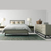 Final lifestyle perspective featuring the bed styled with sage green accents and a textured area rug