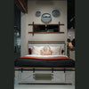 High-angle lifestyle shot of the bed styled with neutral linens in a contemporary farmhouse-inspired room