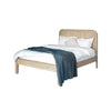 Lifestyle shot featuring the Opera bed styled with white bedding and a blue textured throw in a bright room