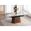 Perspective lifestyle view of the table in a complete dining arrangement featuring natural light and floral accents
