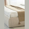 Detailed view of the bottom corner of the bed frame showcasing the uniform upholstery and seamless transition to the base