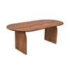 Three-quarter perspective view showcasing the slim oval tabletop and architectural curved base of the walnut table