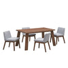 Front perspective lifestyle view of the Bessa table styled with two grey upholstered chairs in a bright setting