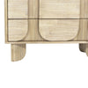 Macro detail shot showcasing the rhythmic vertical fluting and smooth rounded edges of the Haru chest facade
