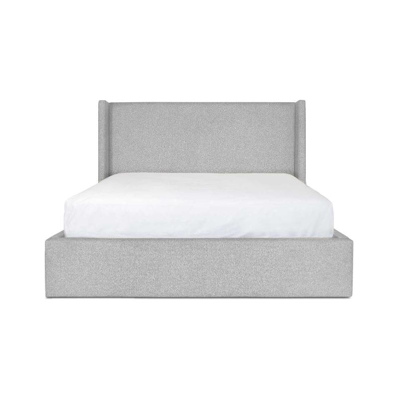 Three-quarter perspective view highlighting the plush upholstered frame and the clean architectural lines of the wingback headboard