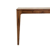 Close-up shot emphasizing the architectural flared leg design and smooth wood joinery of the Allure table