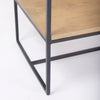 Close-up view of the bottom corner construction showing the solid metal base and floor-level shelf