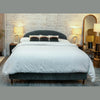 Straight-on lifestyle view of the teal upholstered bed showcasing a complete modern master bedroom arrangement