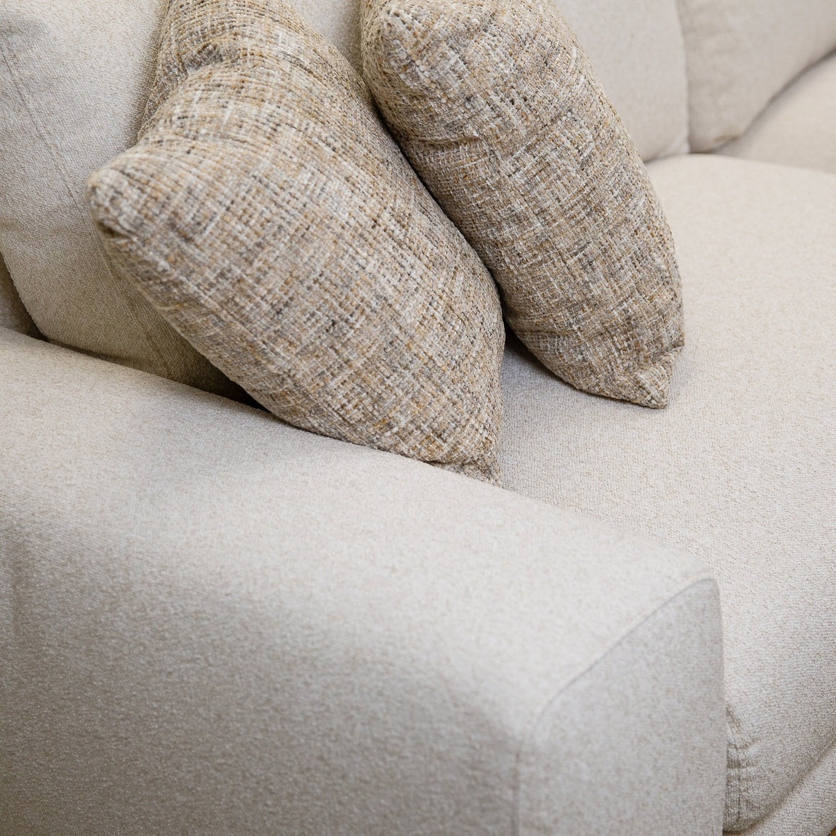 Front view of Mylo 4-seater cream sofa with wood base