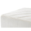Close-up detail of the vertical ribbed corduroy fabric texture on the corner of the Nami sectional