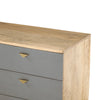 Close-up shot focusing on the warm natural wood grain and high-quality finish of the sideboard's top surface