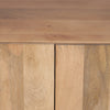 Macro shot highlighting the organic wood grain and flush-mount door design of the base cabinet