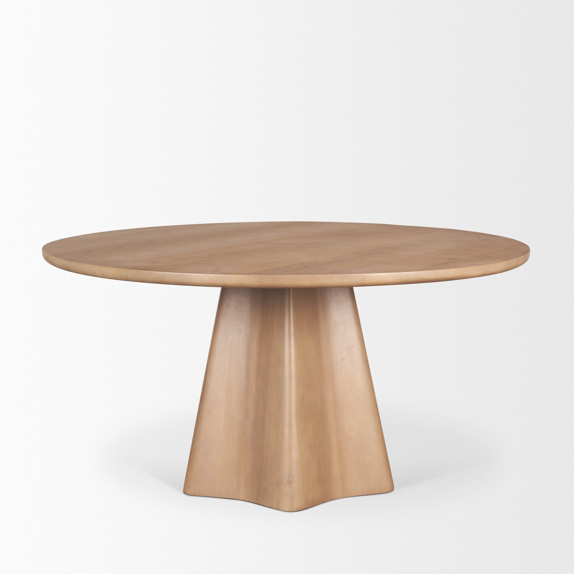 Front view of the Jovani round dining table in a dark mango wood finish featuring a sculptural faceted pedestal base
