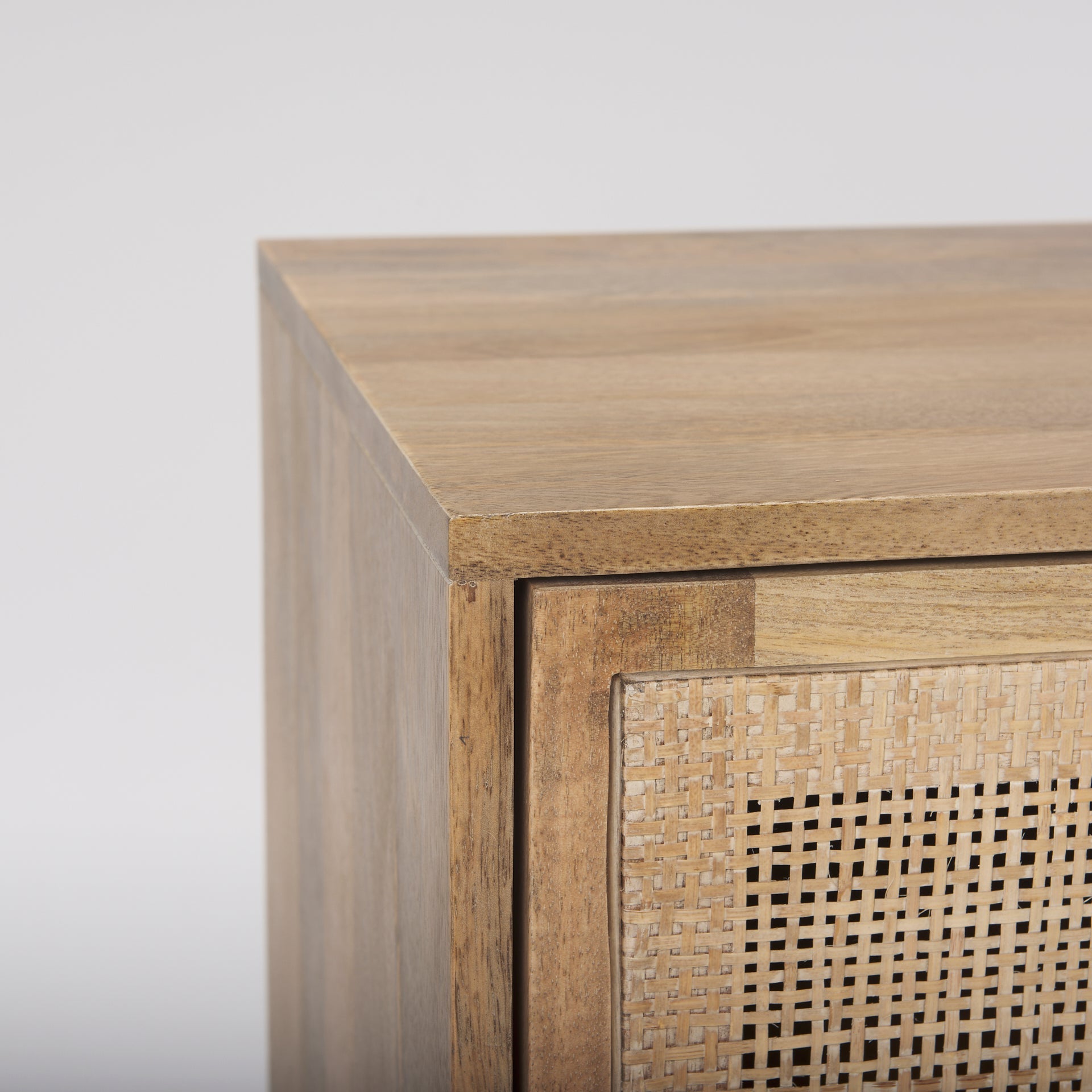 Close-up shot focusing on the smooth mango wood tabletop showcasing the organic grain and blonde wood tones