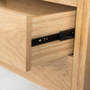 Close-up perspective of an open drawer highlighting the smooth black metal side glides and high-quality internal wood construction