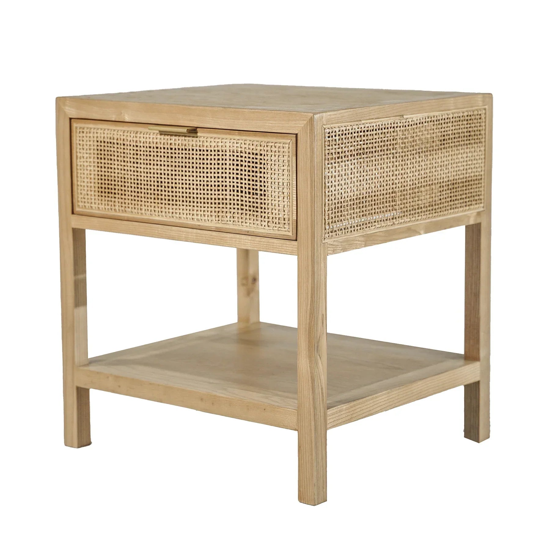 Straight-on front view showcasing the woven rattan drawer front and minimalist brass hardware on a light wood frame