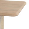 Detailed high-angle shot focusing on the soft rounded corner and the authentic wood grain of the oak tabletop