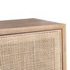 Close-up shot focusing on the high-quality joinery between the natural wood frame and the detailed weave of the rattan insert
