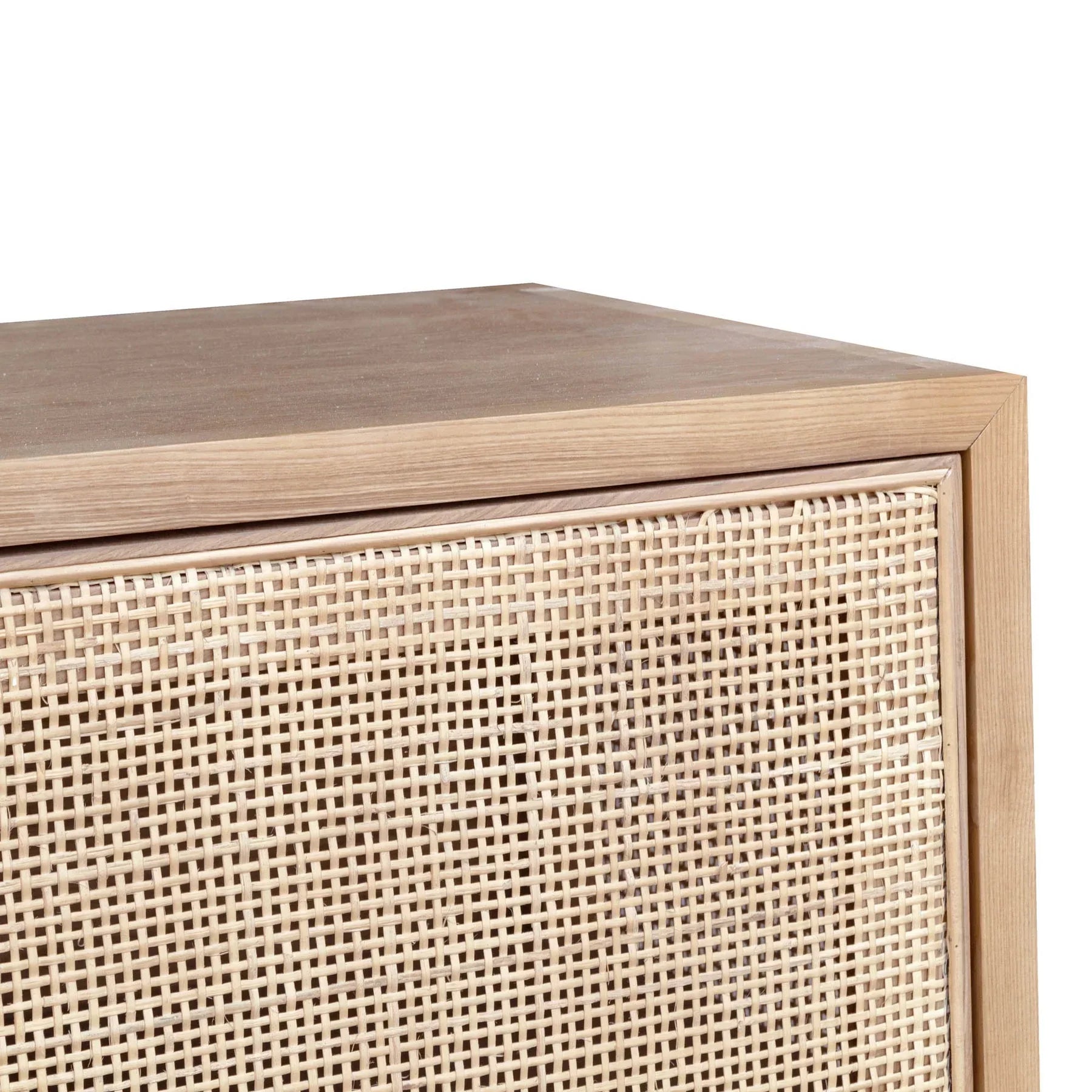 Straight-on front view highlighting the symmetrical three-door layout and the organic texture of the light-toned rattan panels