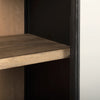 Close-up interior shot showcasing the high-quality wood shelf edge against the black frame