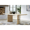 Real-home lifestyle perspective showcasing the table styled in a bright modern dining room with a patterned rug