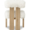 Rear view showcasing the unique vertical wooden slats that support the upholstered sheepskin backrest
