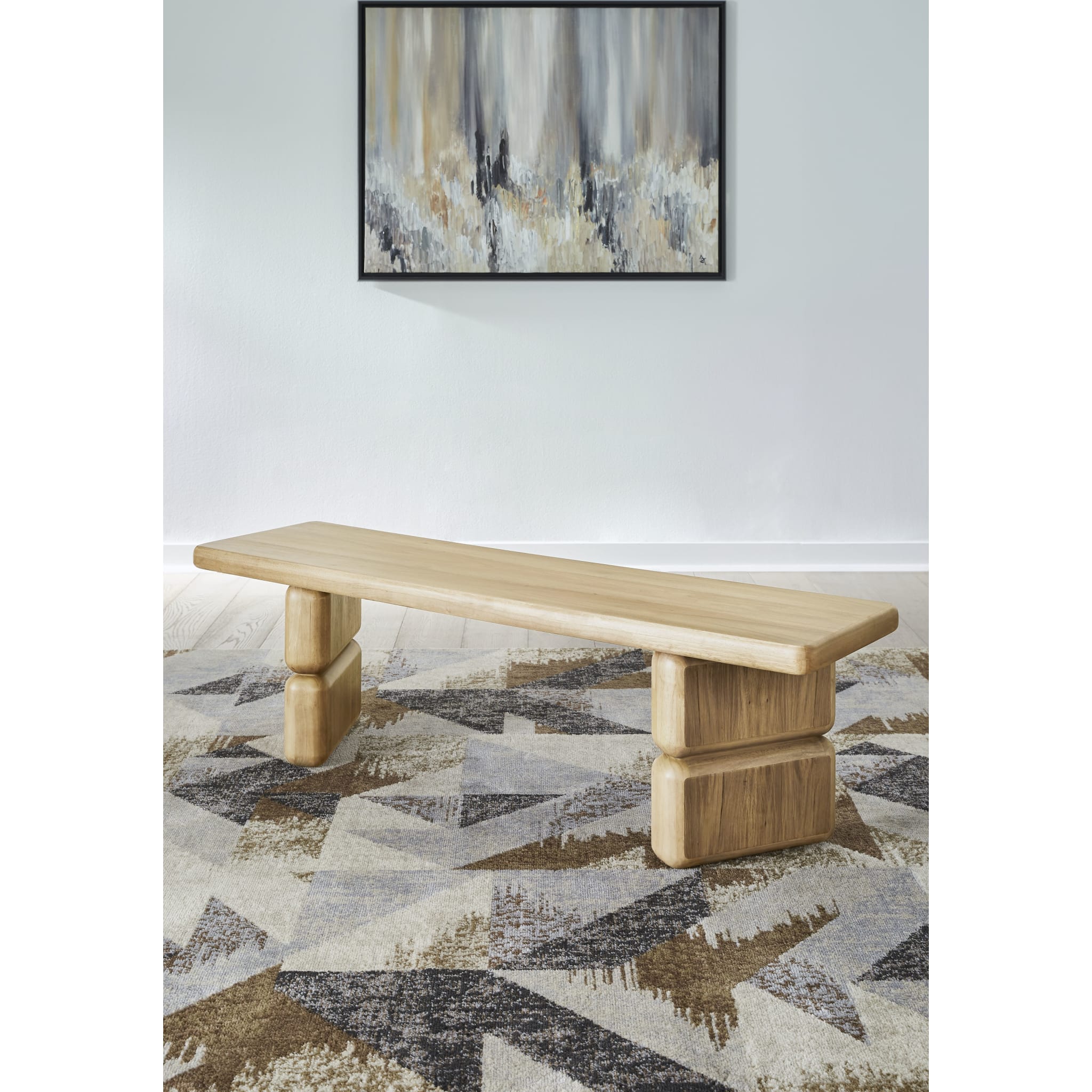 Portrait-oriented lifestyle shot featuring the Nelly bench as a standalone piece in a bright modern interior